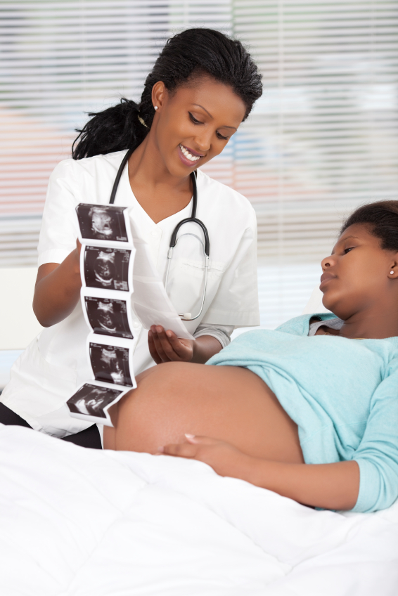 Pregnant woman looking at ultrasound results