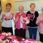 Ladies standing together with their decorated bras